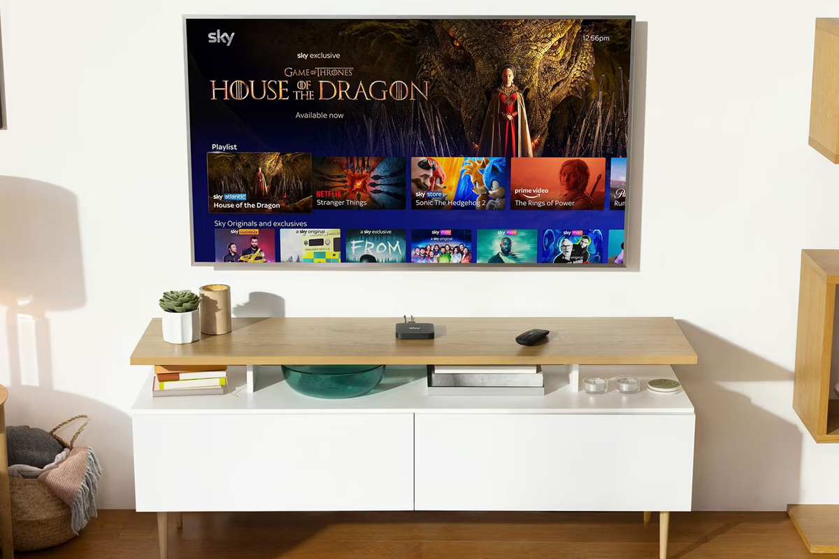 sky stream box pictured next to a remote with game of thrones spin off house of the dragon pictured on-screen on the television