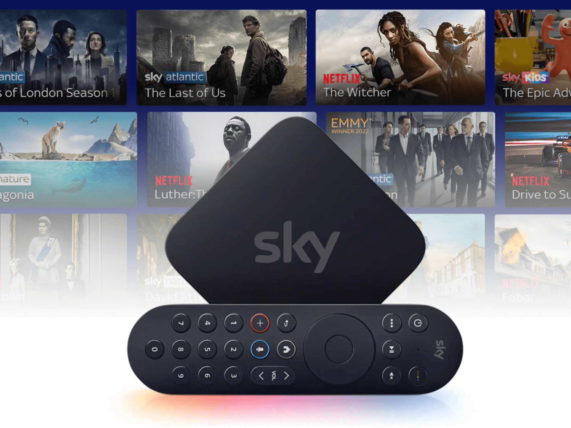 Sky Stream box with the remote control on its side with a selection of shows in the background