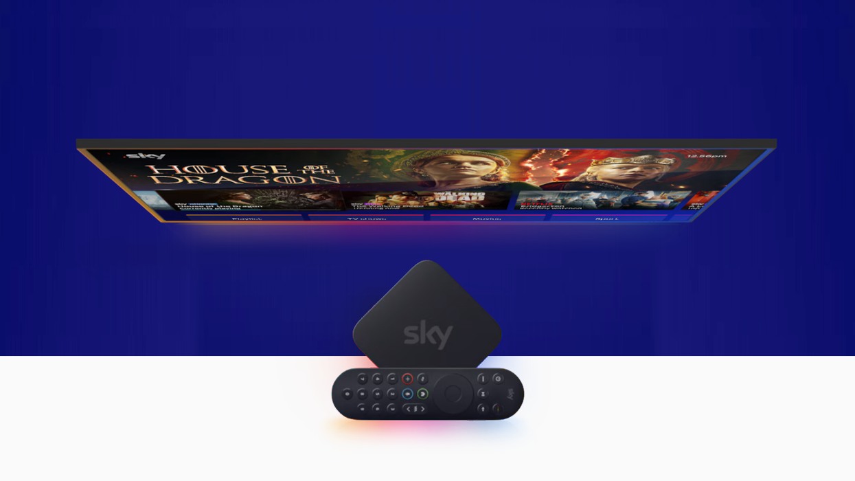 Sky Stream box with the remote placed across it, with SkyOS showing on a flatscreen television