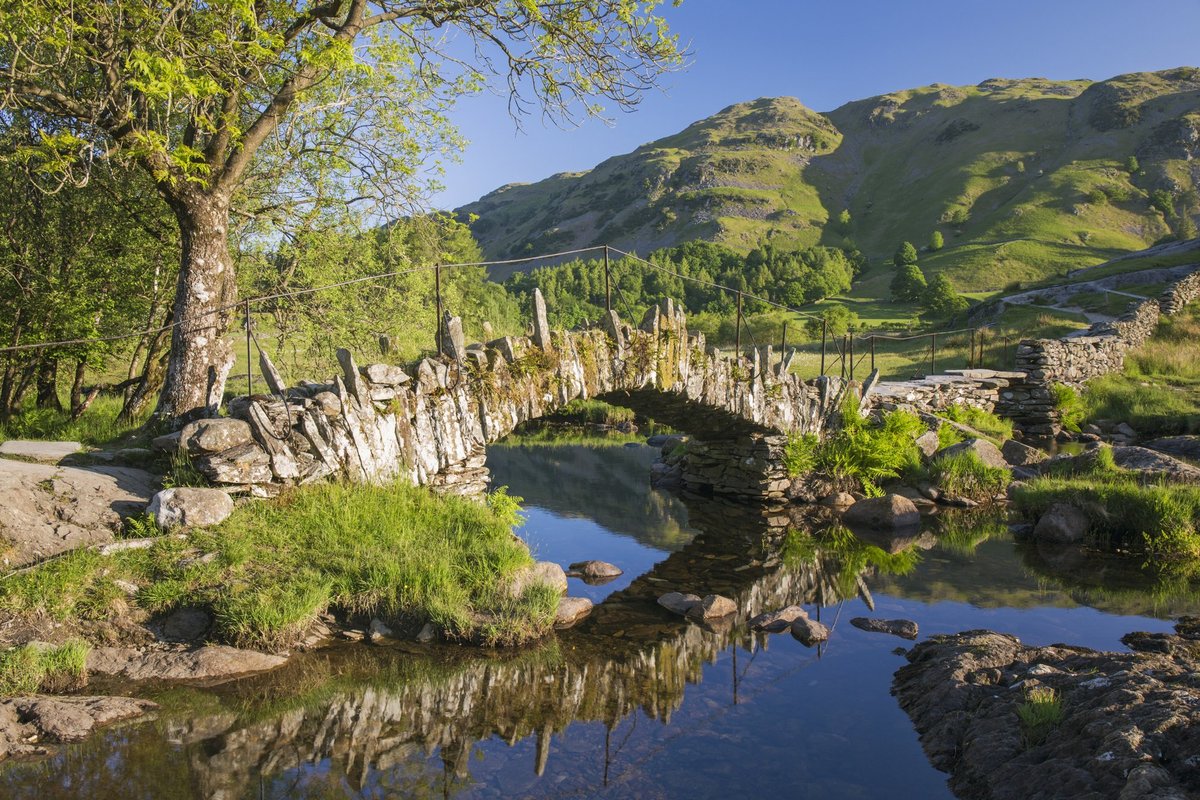 Slater's Bridge reflected in the tranquil waters of the River Brathay (file pic)