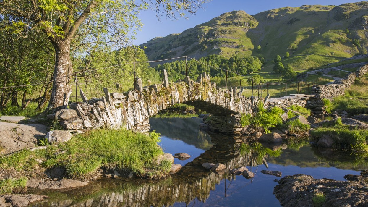 Slater's Bridge reflected in the tranquil waters of the River Brathay (file pic)