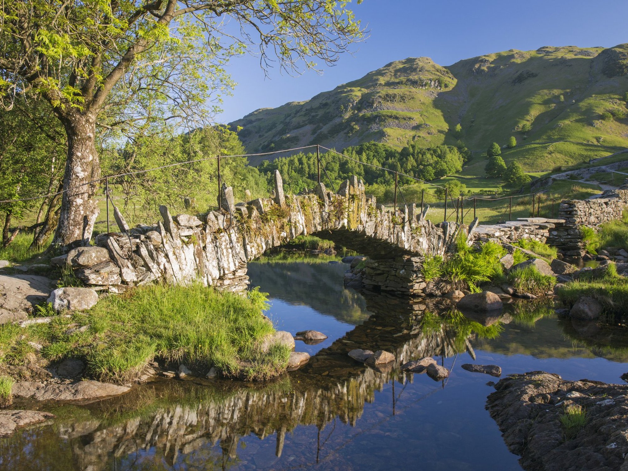 Slater's Bridge reflected in the tranquil waters of the River Brathay (file pic)