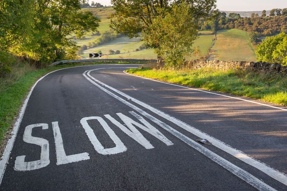 Slow sign on a rural road
