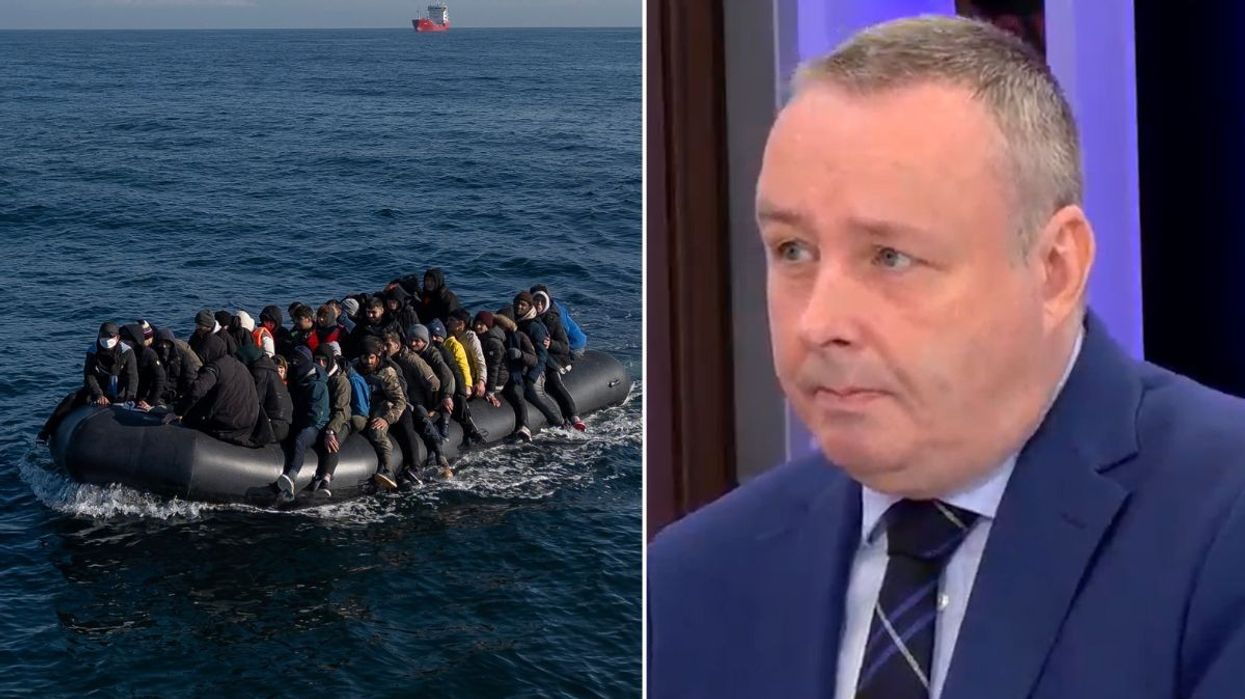 Small boat with migrants and Mark White