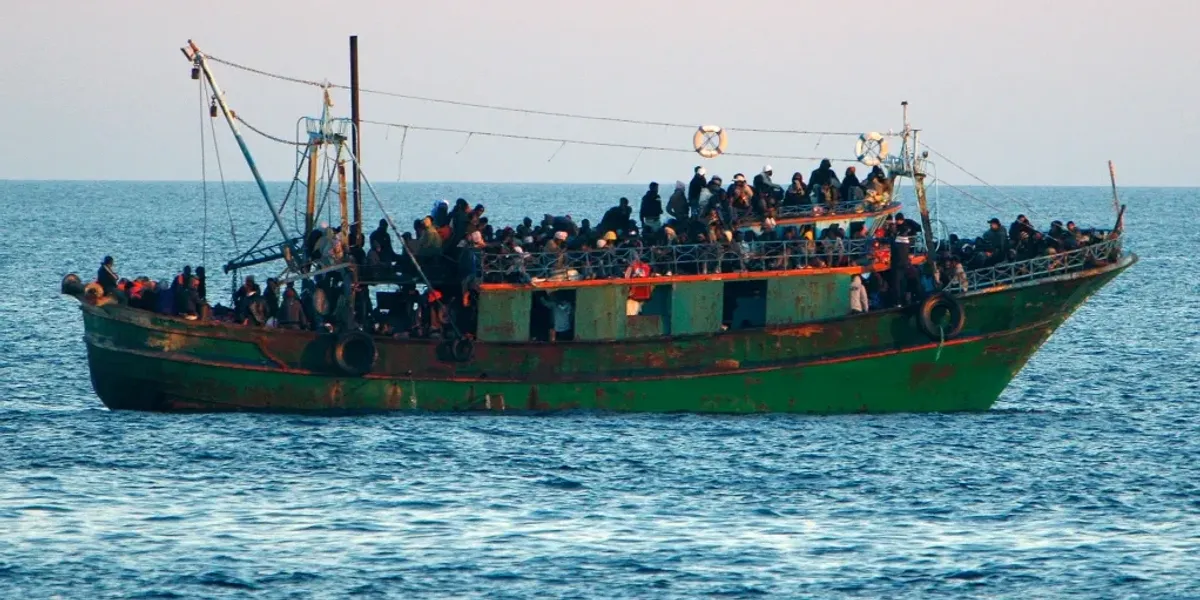 NextImg:Small boat migrant became £12million people smuggler kingpin from taxpayer-funded flat