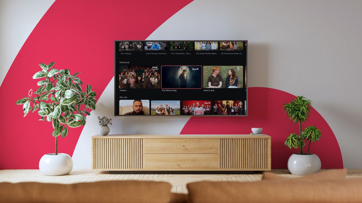 smart tv with freely on-screen and the freely logo in the background