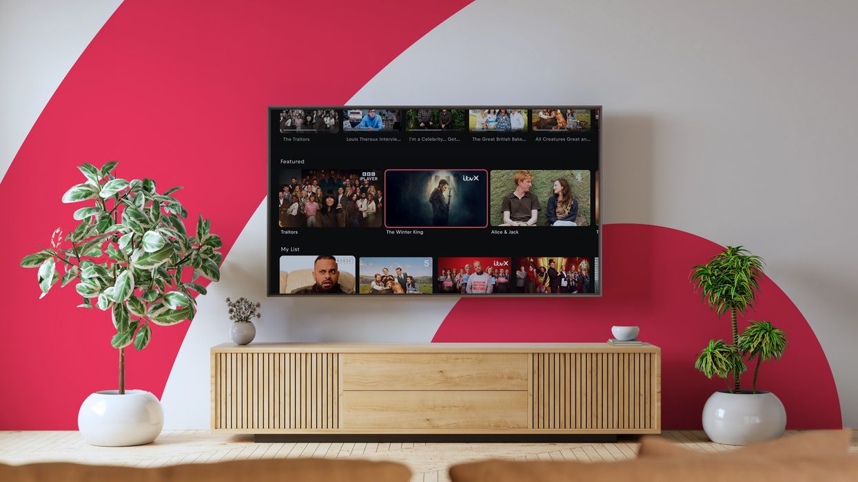 smart tv with freely on-screen and the freely logo in the background