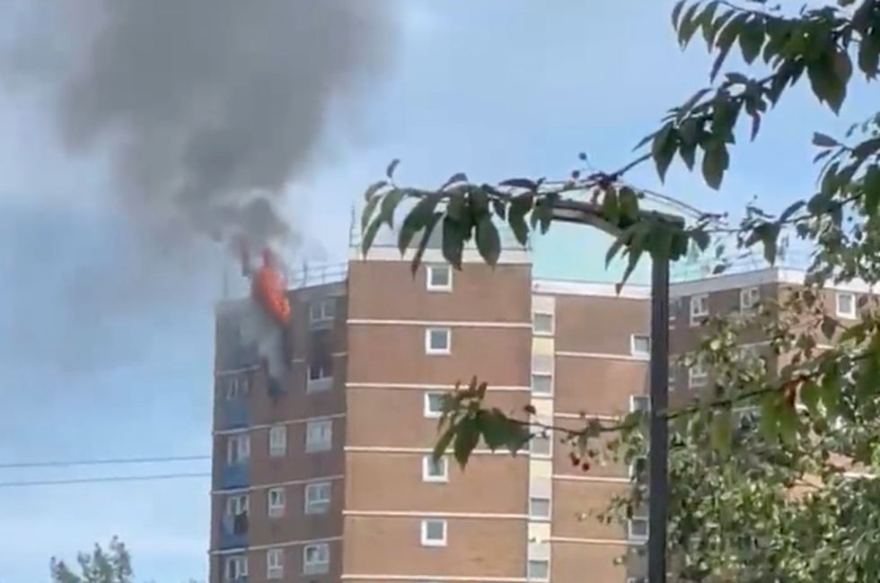 Smoke billowed from the 15-storey building