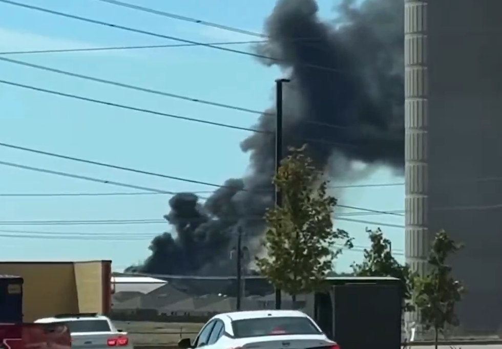 Smoke billows into the sky after Sunday's plane crash