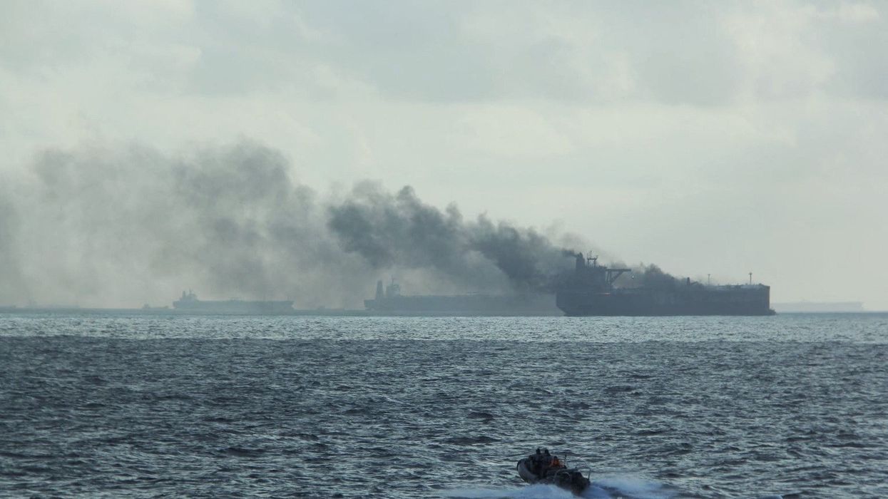 Smoke could be seen from one of the freighters