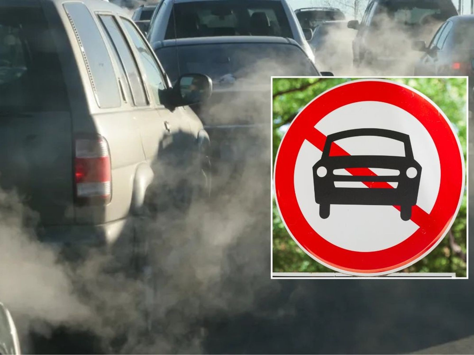 Smoke filled road and a car ban sign