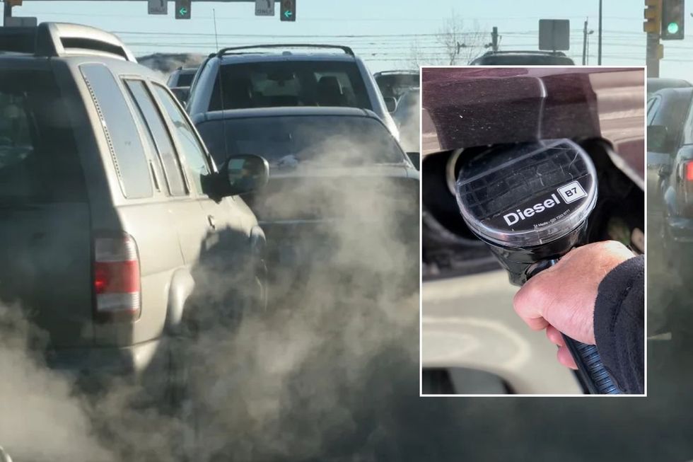 Smoke from car exhausts and a diesel pump