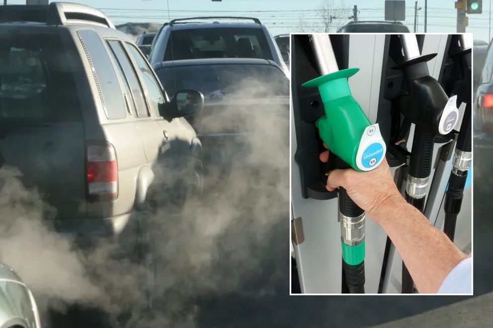 Smoke from car exhausts and a petrol and diesel pump