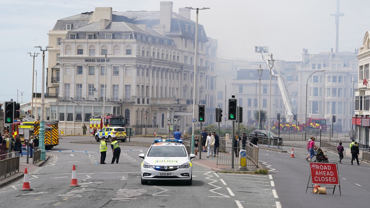 Blaze rips through historic Brighton hotel as strong winds hinder firefighters