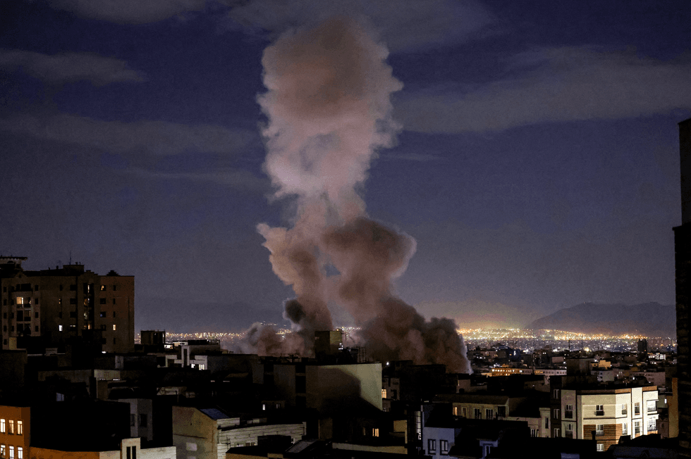 smoke plume rises following a missile strike on a building in Tehran on March 1, 2026. The United States and Israel launched strikes against Iran on February 28, killing Iran's supreme leader and top military leaders, prompting authorities to retaliate with strikes on Israel and US bases across the Gulf.