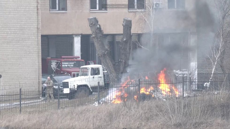 Smoke rises as a fire burns on the premises of the Ukrainian Defence Ministry's unit, in Kyiv, Ukraine February 24, 2022 in this screen grab taken from a live video. REUTERS TV/via REUTERS