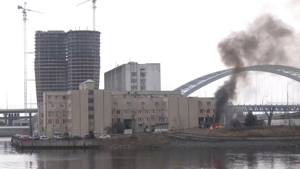 Smoke rises as a fire burns on the premises of the Ukrainian Defence Ministry's unit, in Kyiv, Ukraine February 24, 2022 in this screen grab taken from a live video. REUTERS TV/via REUTERS
