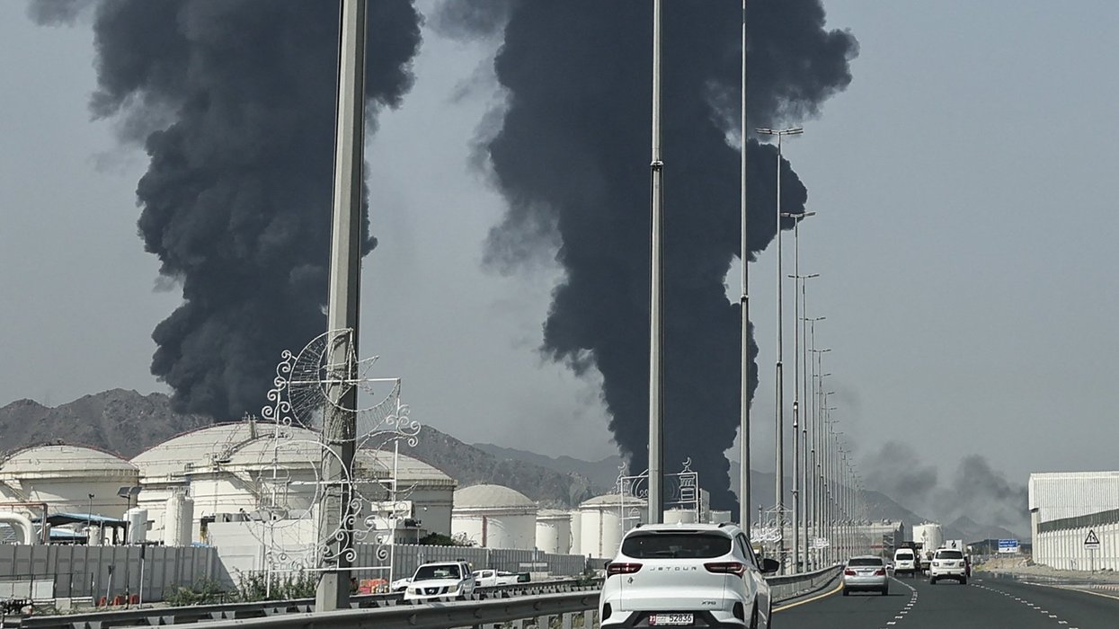 Smoke rises from the direction of an energy installation in the Gulf emirate of Fujairah on March 14, 2026