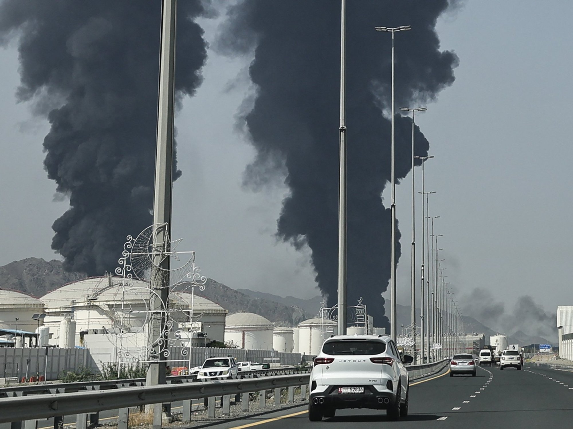 Smoke rises from the direction of an energy installation in the Gulf emirate of Fujairah on March 14, 2026