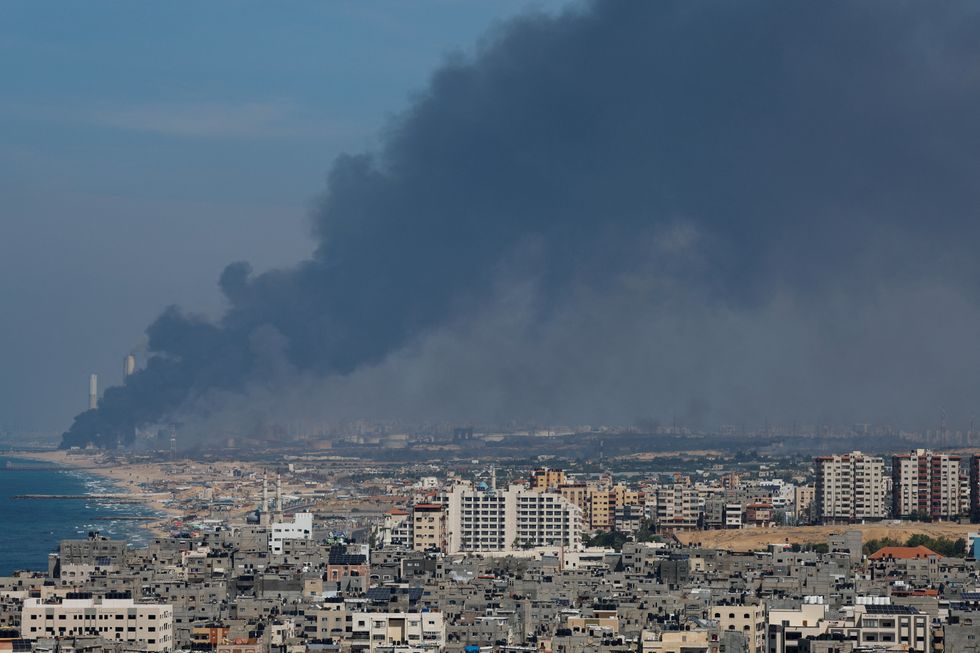 Smoke rises from the Israeli side after Palestinian Hamas gunmen infiltrated areas of southern Israel