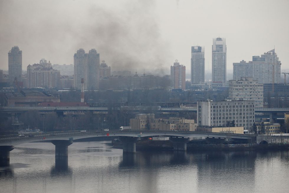 Smoke rises from the territory of the Ukrainian Defence Ministry's unit, after Russian President Vladimir Putin authorised a military operation in eastern Ukraine, in Kyiv, Ukraine February 24, 2022. REUTERS/Valentyn Ogirenko