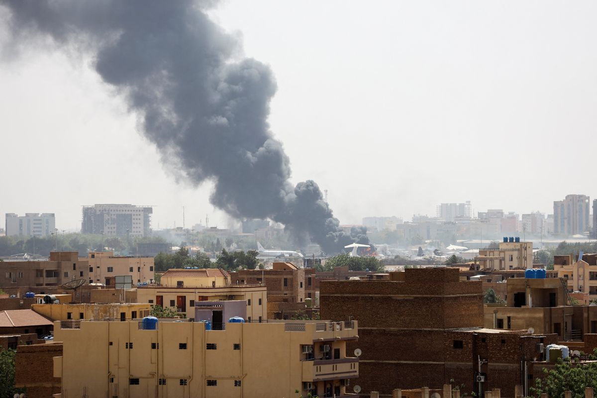 Smoke rises over apartment blocks in Khartoum
