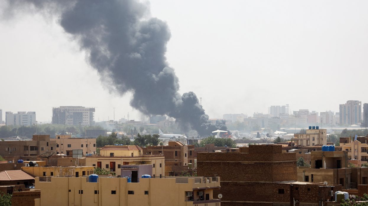 Smoke rises over apartment blocks in Khartoum