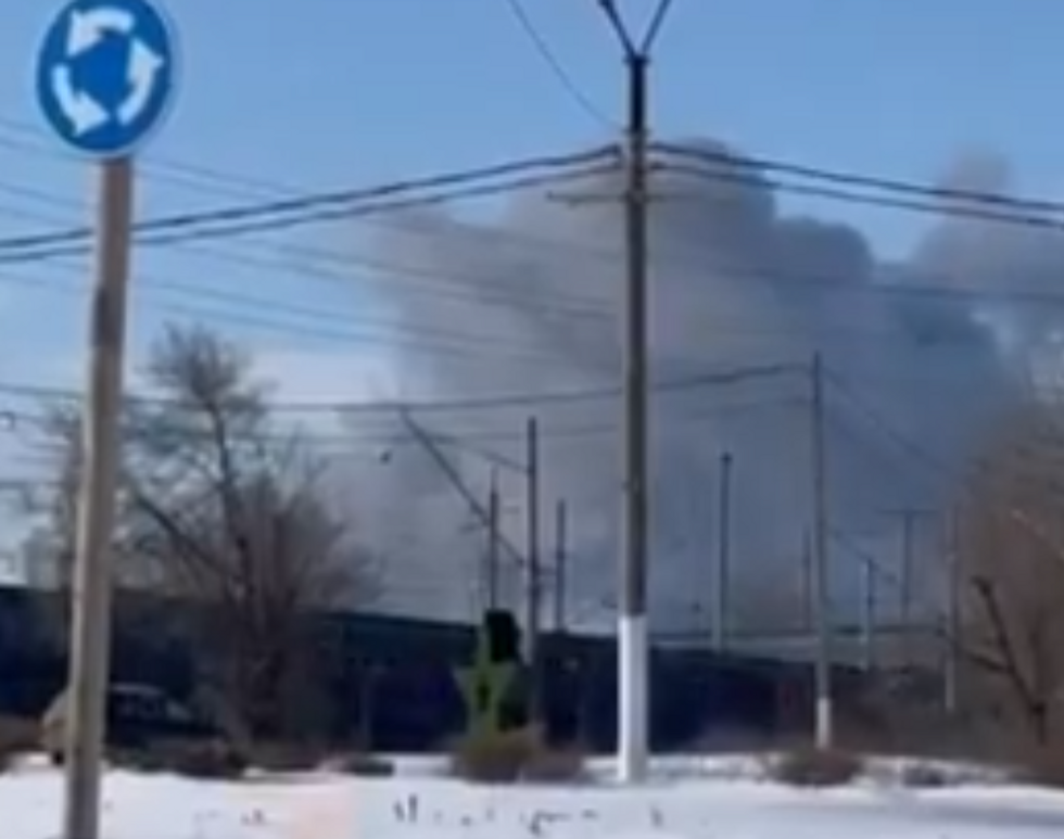 Smoke rising above a factory