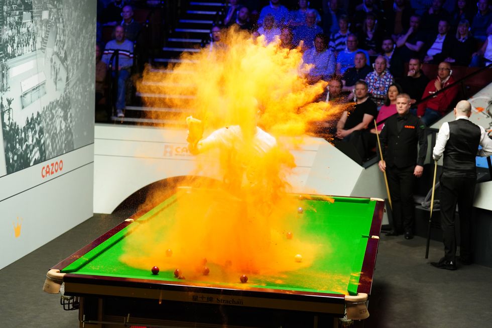 Snooker table covered in orange powder