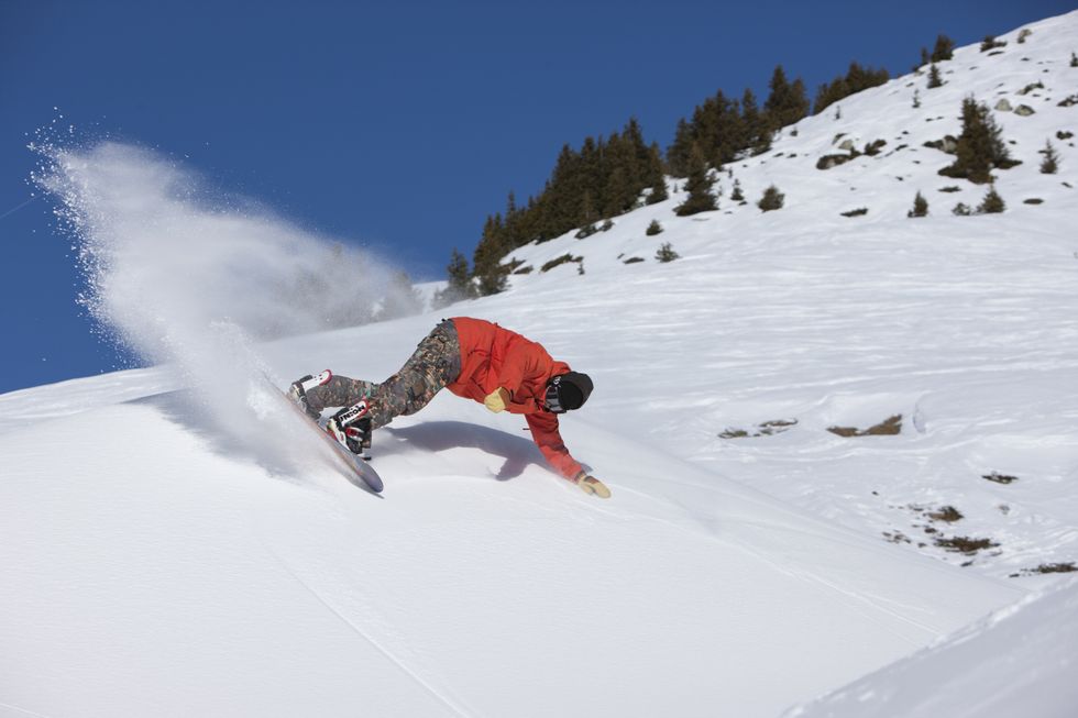 Snowboarder in La Plagne ski resort in the French Alps