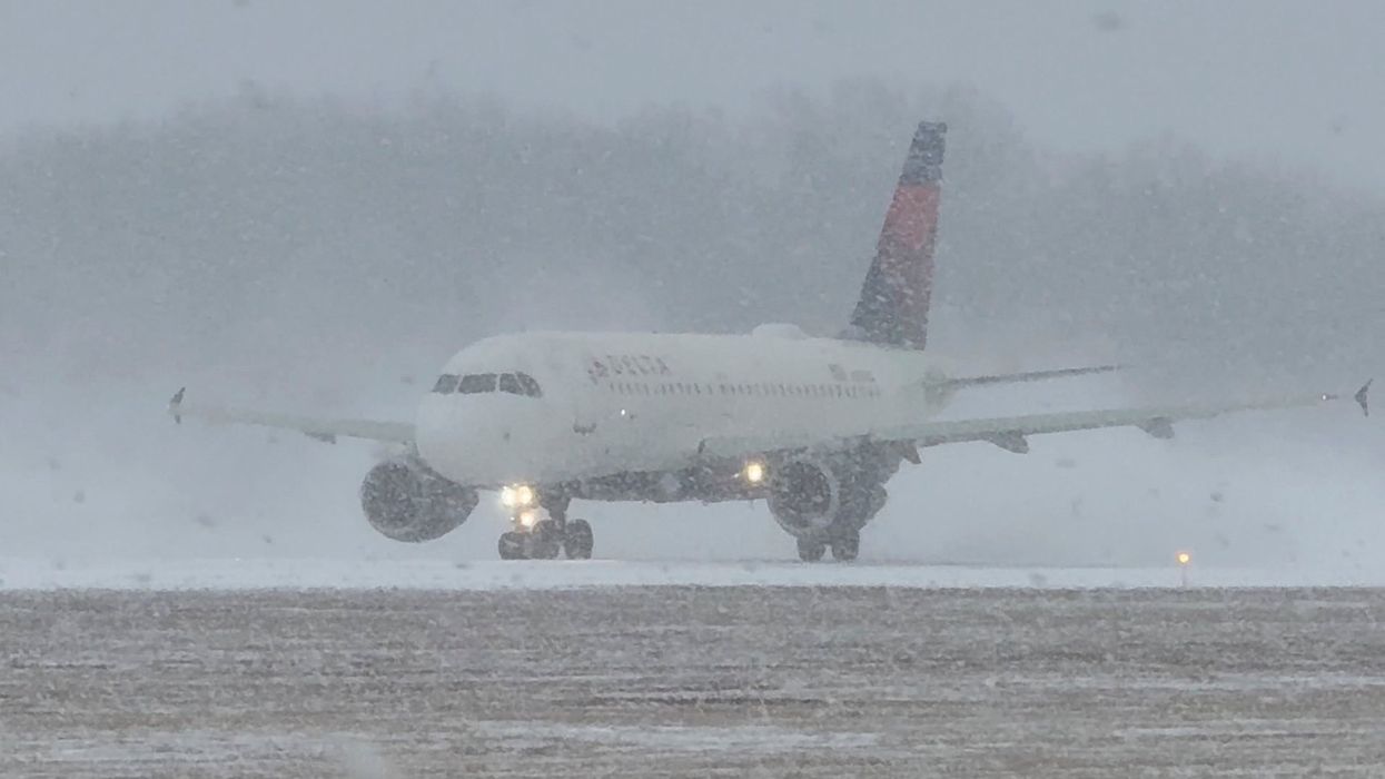 Snowbound plane at Greater Rochester International Airport