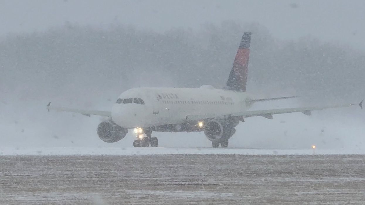 Snowbound plane at Greater Rochester International Airport