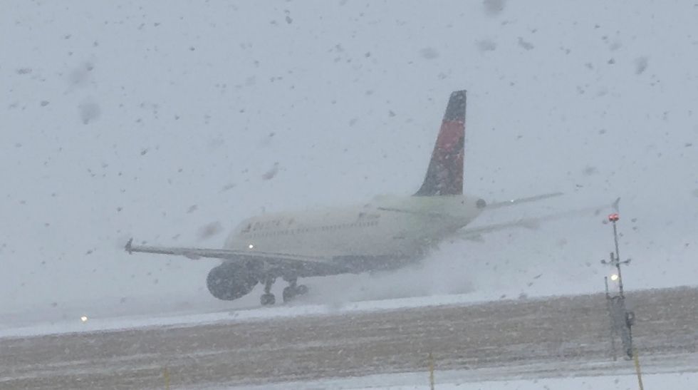 Snowbound plane at Greater Rochester International Airport
