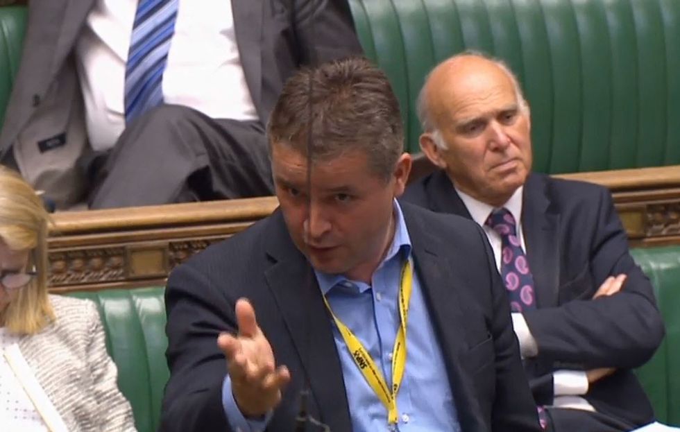 SNP MP Angus Brendan MacNeil intervenes on Chancellor Philip Hammond while not wearing a tie