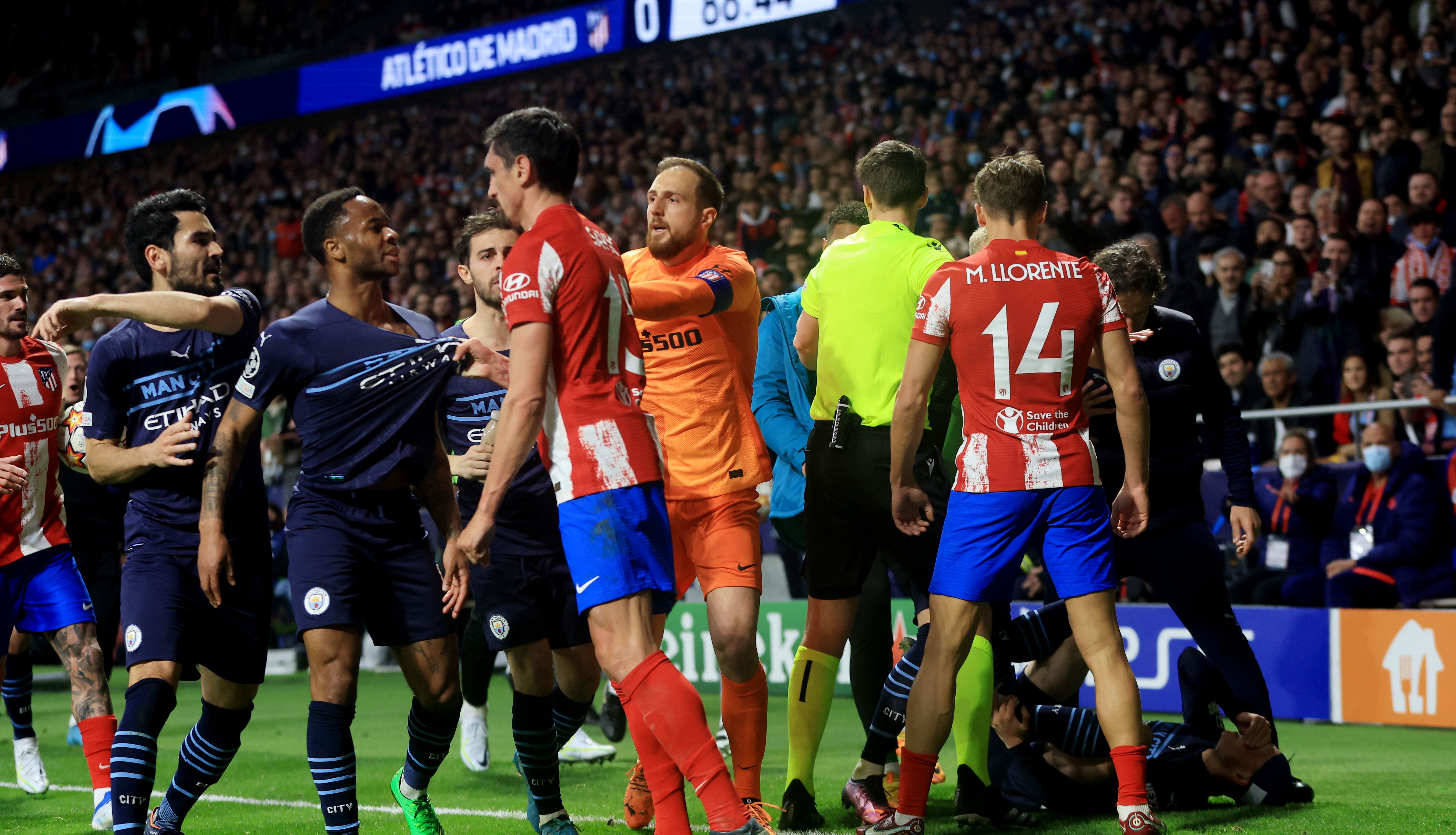 Soccer Football - Champions League - Quarter Final - Second Leg - Atletico Madrid v Manchester City - Wanda Metropolitano, Madrid, Spain - April 13, 2022 Manchester City's Raheem Sterling clashes with Atletico Madrid's Stefan Savic during the match Action Images via Reuters/Lee Smith