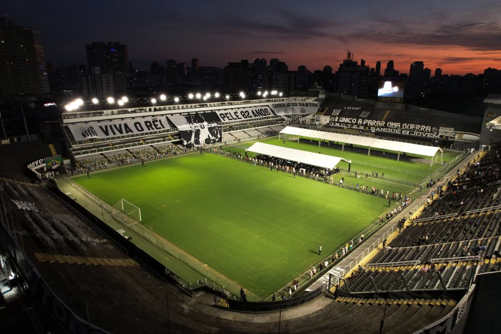 Soccer Football - Death of Brazilian soccer legend Pele - Vila Belmiro Stadium, Santos, Brazil - January 2, 2023 General view at the stadium as dusk falls in Vila Belmiro as mourners queue to pay their respect during his funeral tribute REUTERS/Amanda Perobelli