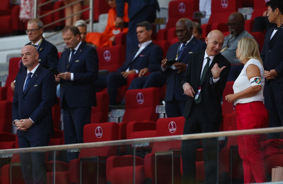 Soccer Football - FIFA World Cup Qatar 2022 - Group E - Germany v Japan - Khalifa International Stadium, Doha, Qatar - November 23, 2022 German Interior Minister Nancy Faeser is seen wearing the OneLove armband alongside German Football Association president Bernd Neuendorf and FIFA president Gianni Infantino REUTERS/Kai Pfaffenbach