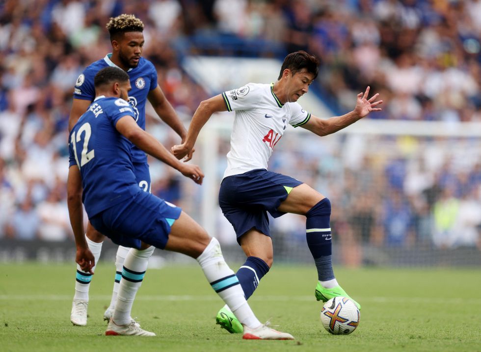 Soccer Football - Premier League - Chelsea v Tottenham Hotspur - Stamford Bridge, London, Britain - August 14, 2022 Tottenham Hotspur's Son Heung-min in action with Chelsea's Ruben Loftus-Cheek and Reece James Action Images via Reuters/Paul Childs EDITORIAL USE ONLY. No use with unauthorized audio, video, data, fixture lists, club/league logos or 'live' services. Online in-match use limited to 75 images, no video emulation. No use in betting, games or single club /league/player publications.  Please contact your account representative for further details.