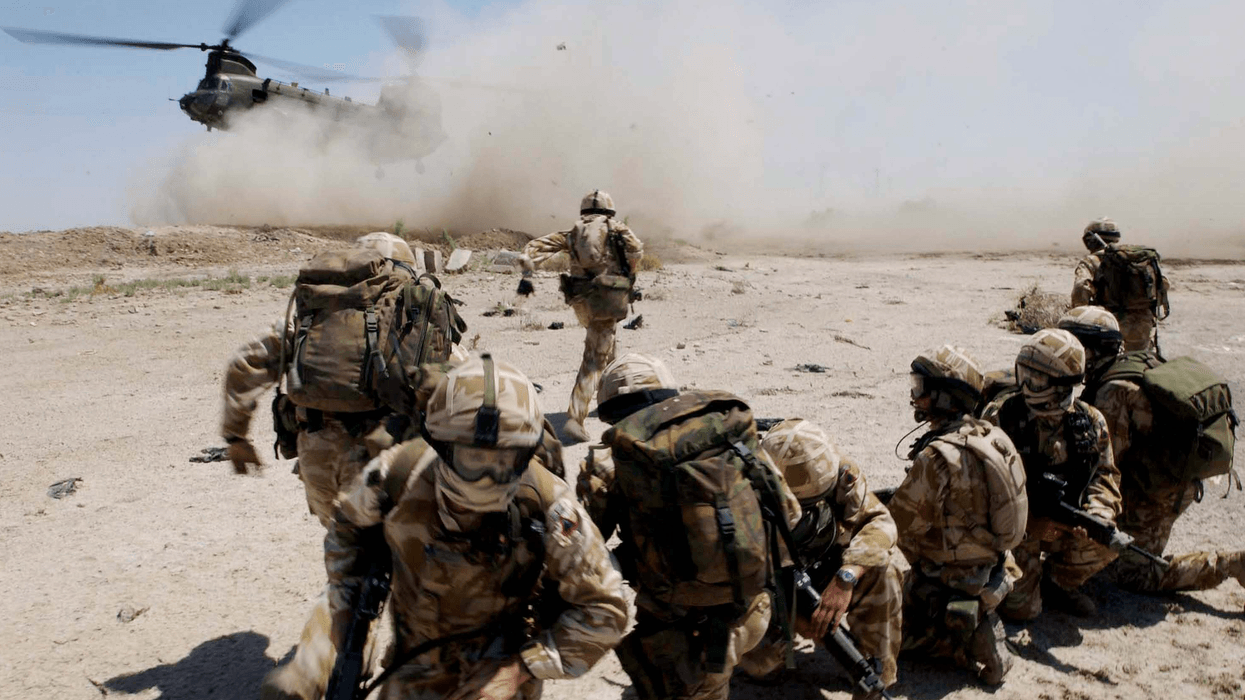 soldiers from the The Royal Welch Fusiliers mount helicopter borne Eagle VCP's (Vehicle Check Points), July 2, 2004 around the southern Iraqi town of Basra.