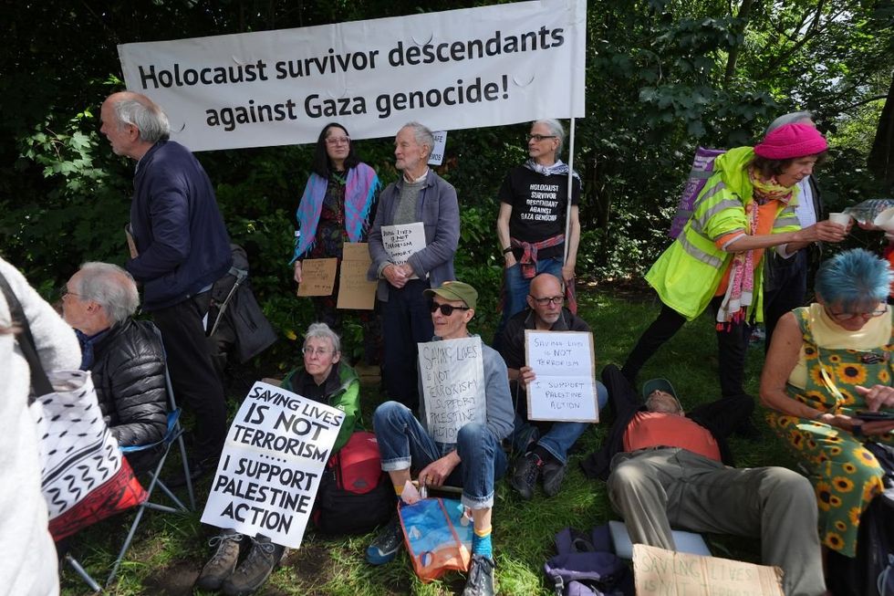 Some of the activists appeared to hold placards in support of Palestine Action