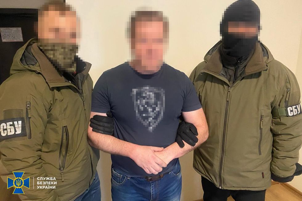 Some of the members were photographed alongside Ukrainian agents