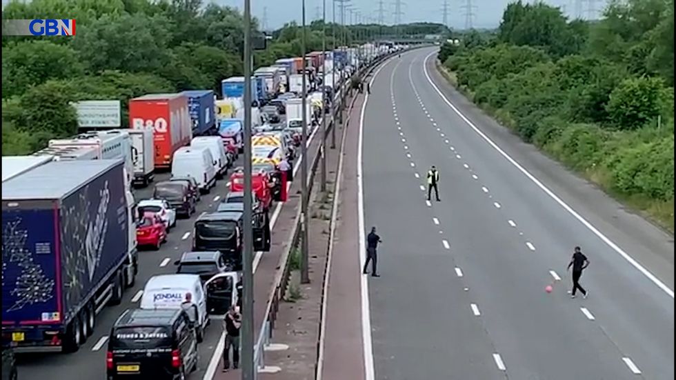 Some people decided to pass the time by playing football while their vehicles remained at a standstill.