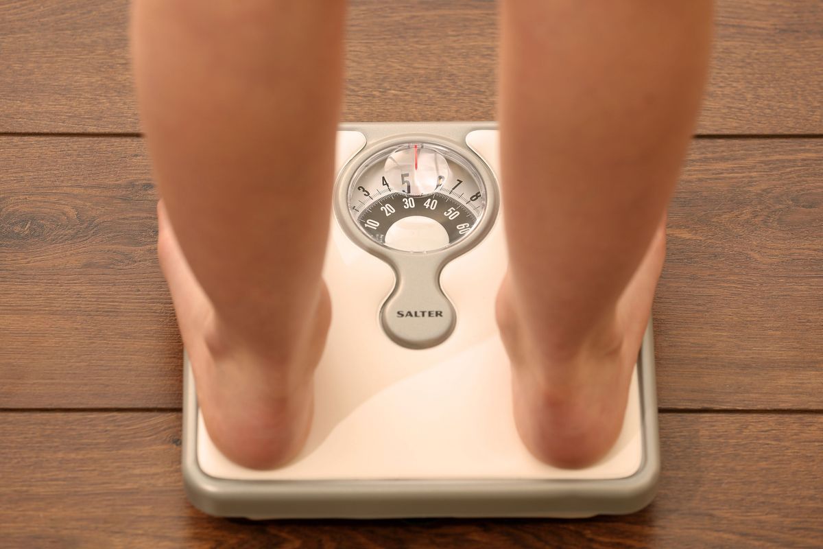 Somebody standing on scales