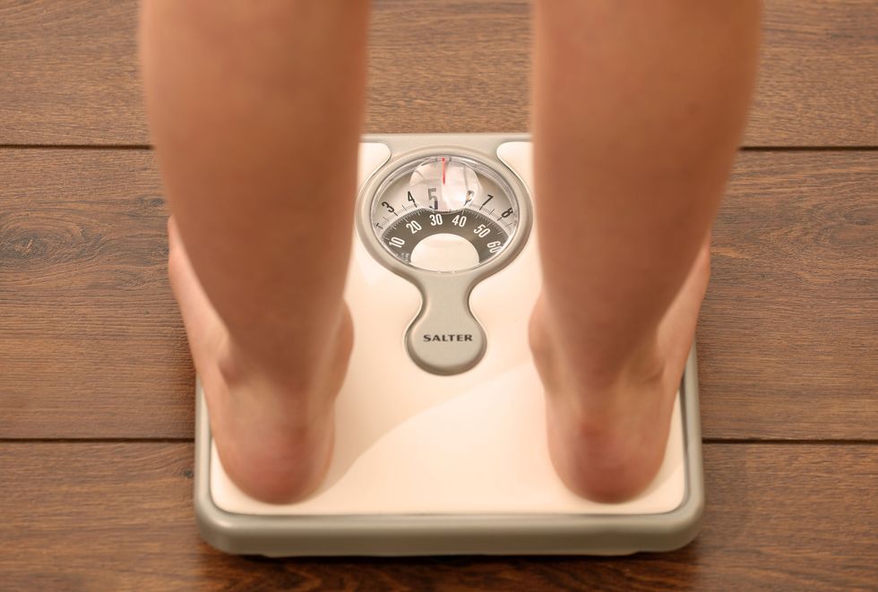Somebody standing on scales