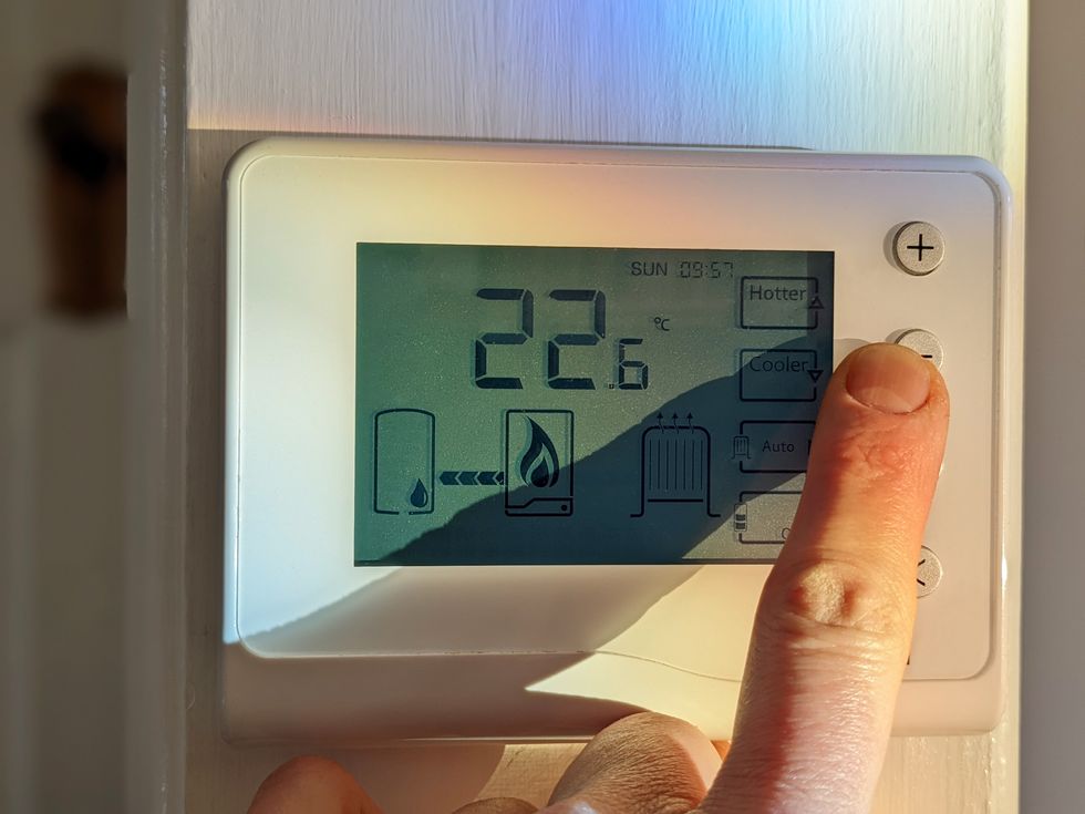 Someone adjusting their heating
