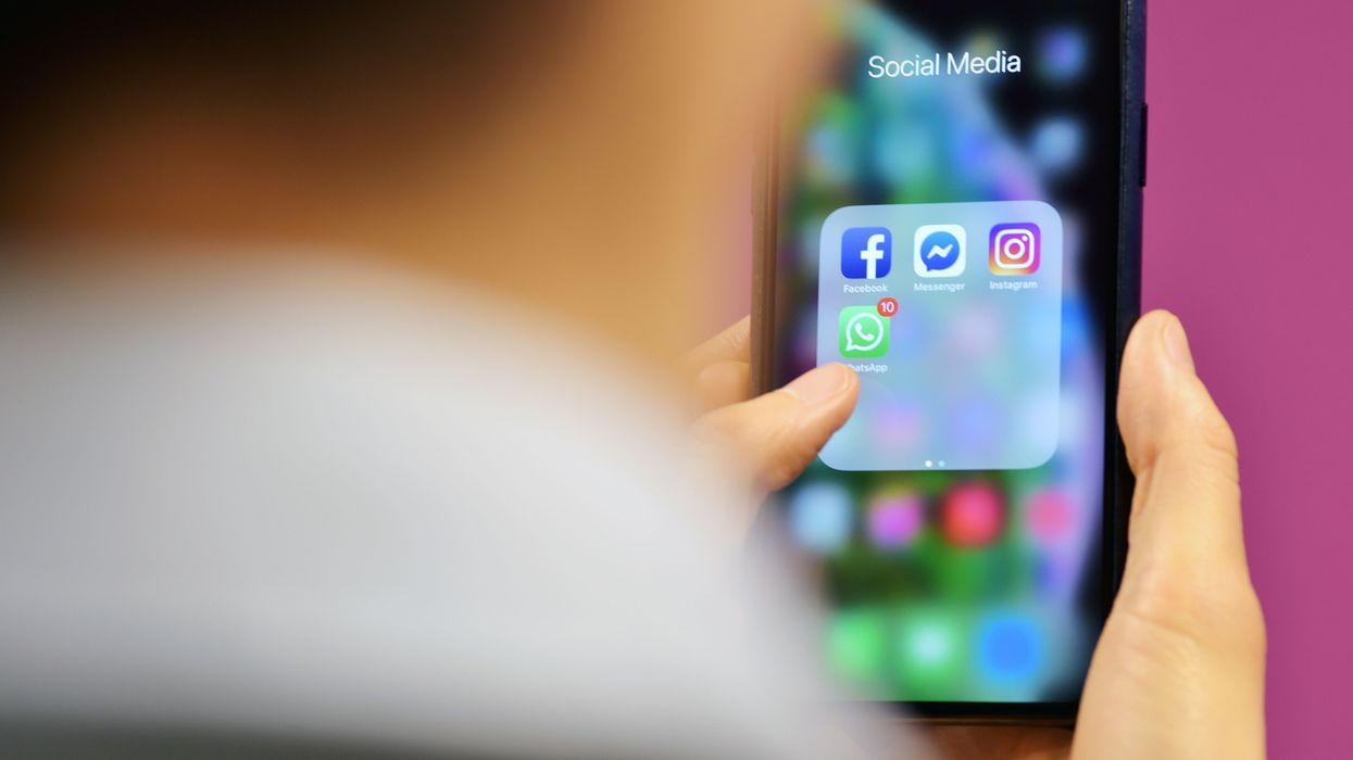 Someone browsing social media apps on phone