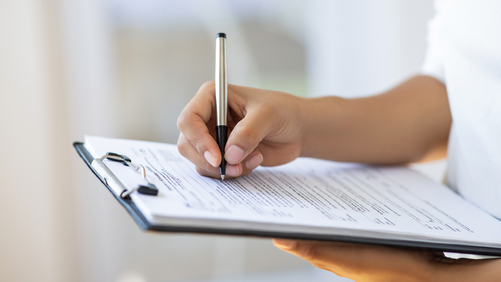 Someone filling out a form