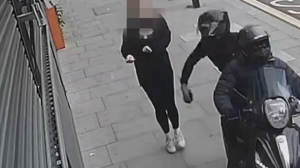Someone having their phone stolen