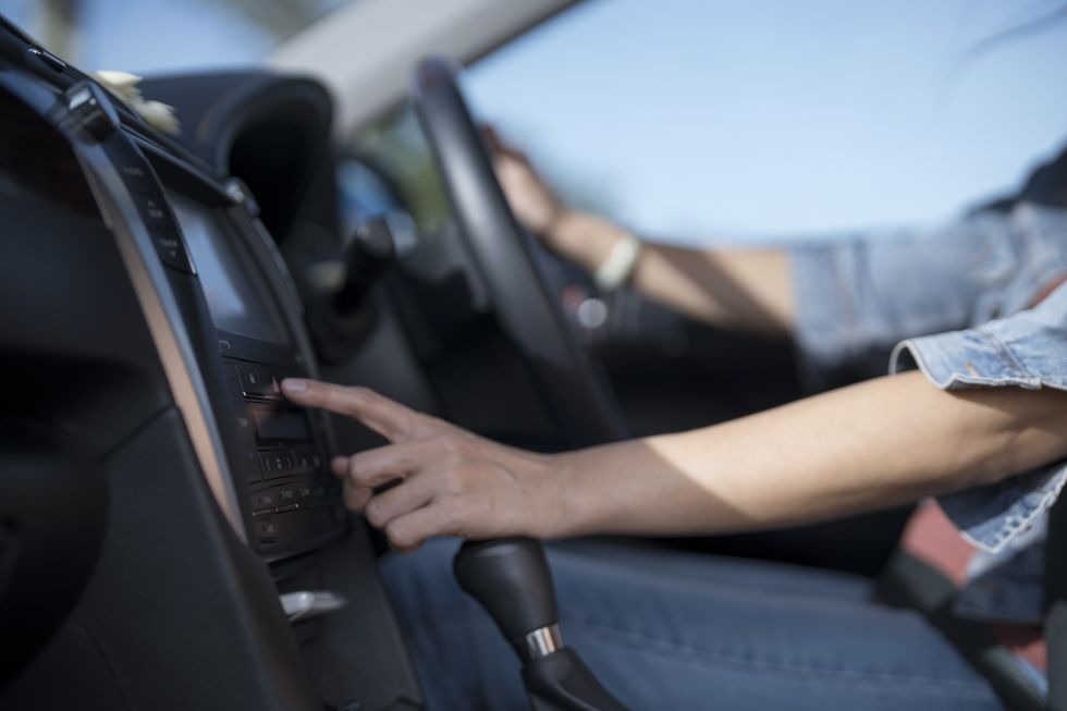 Someone putting on the radio in their car
