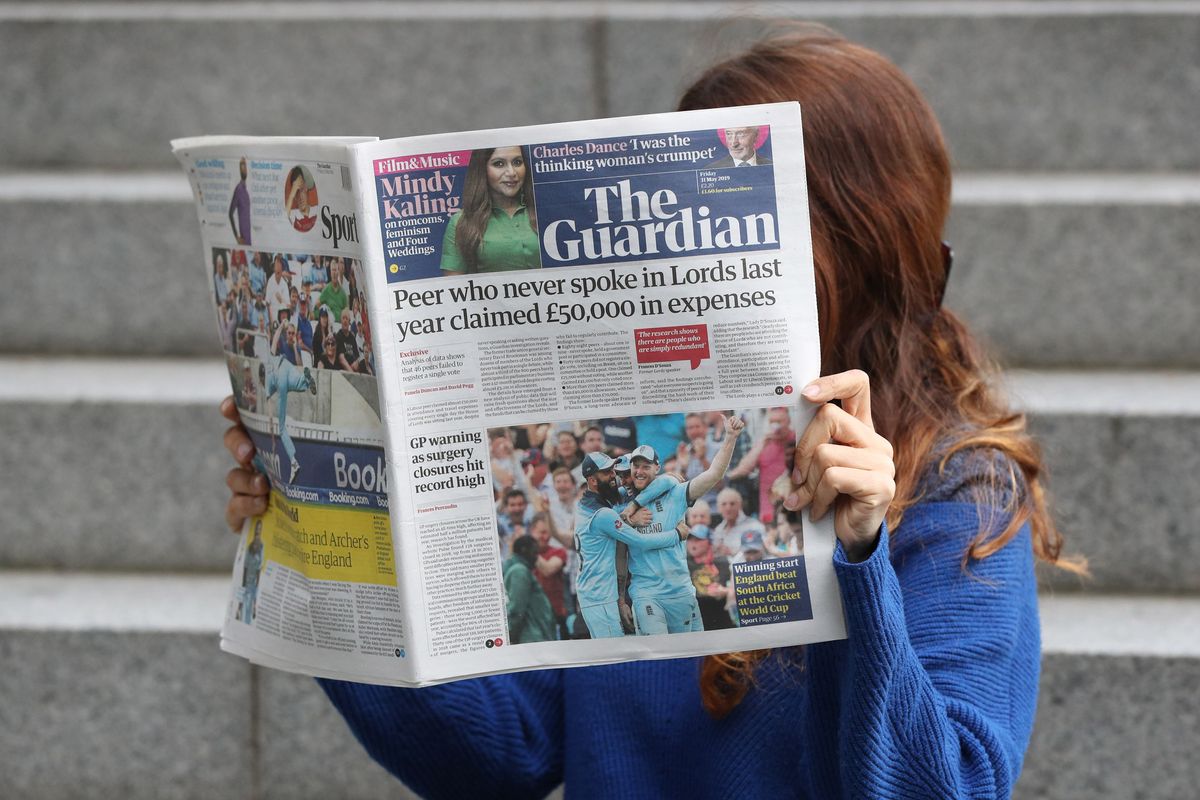 Someone reading The Guardian